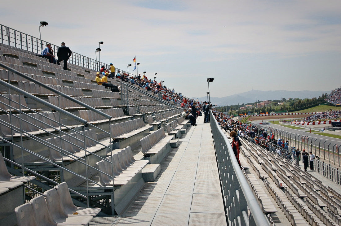 Almost empty tiered grandstand at a racing circuit