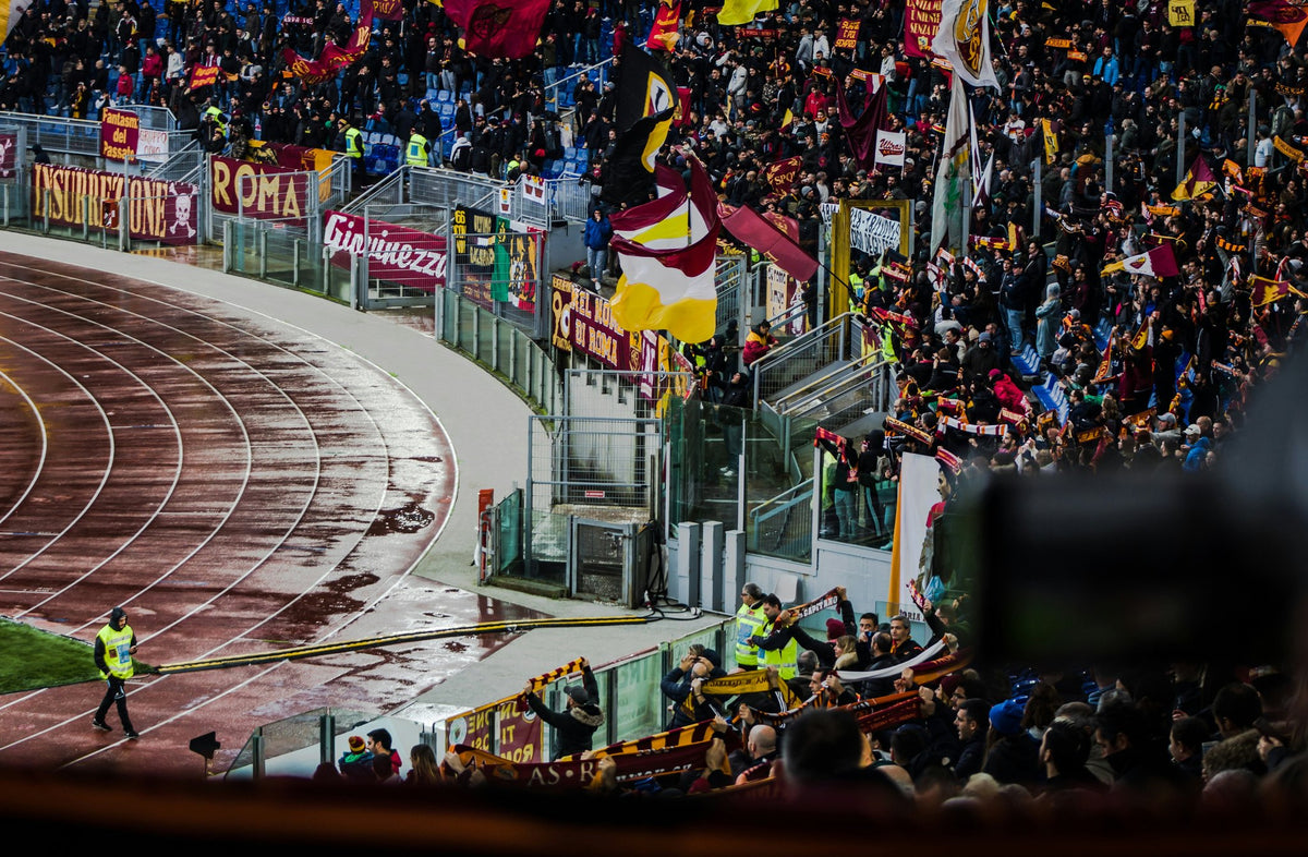 AS Roma supporters with flags and banners in the stands at the Stadio Olimpico
