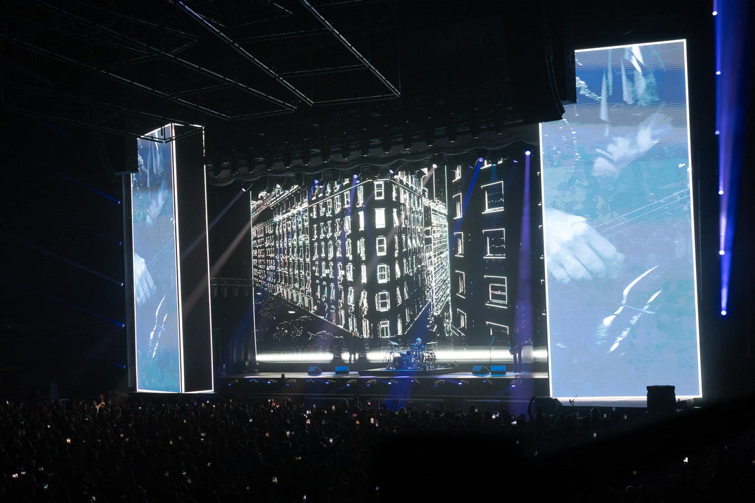 Concert stage with a large video wall and tall LED panels