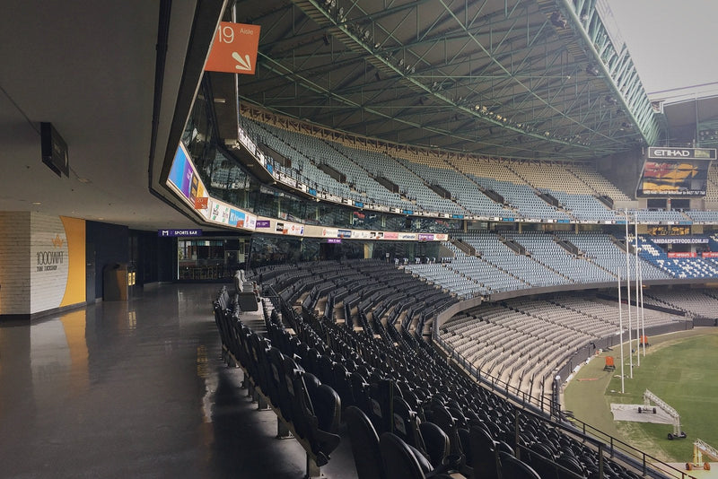 Empty upper concourse and seating tier at Marvel Stadium in Melbourne