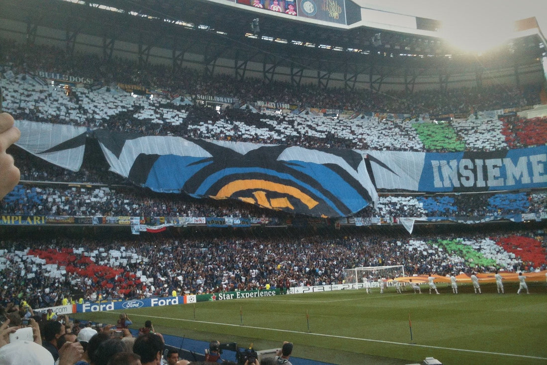 Giant Inter Milan crest banner over a black-and-white card mosaic